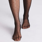 Polka dot patterned tights, 20 denier by Ysabel Mora.